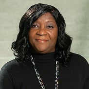Dr. Sharina Person, smiling black woman with shoulder-length black hair