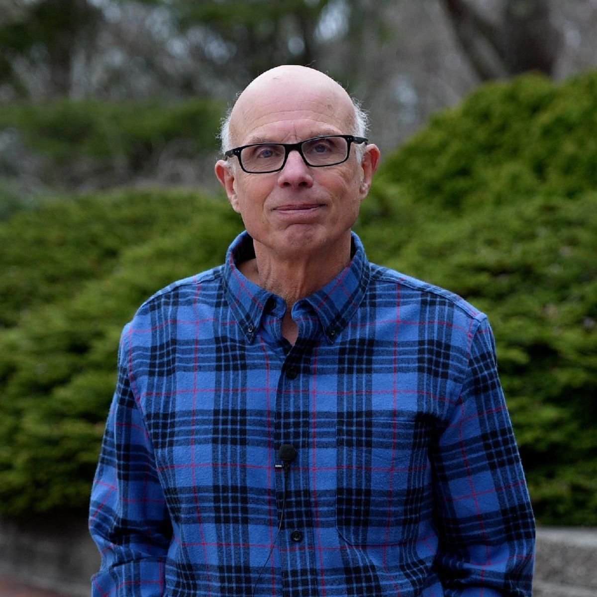 Rob Michaels is wearing a blue plaid shirt