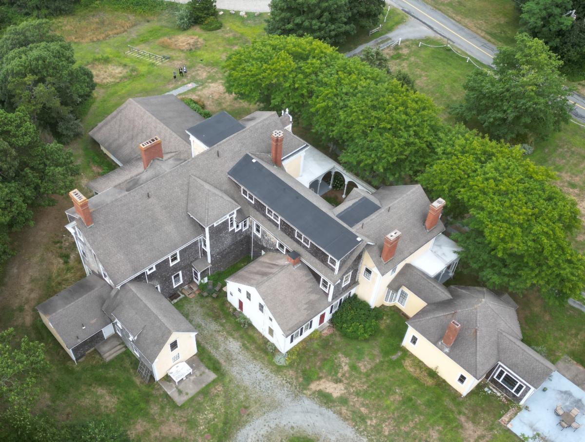 Aerial view from above of the backside of the Crosby Mansion