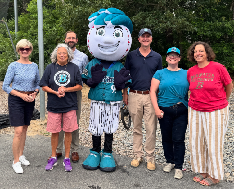Group picture of with Cappy the Whitecap mascot and members of the select board and town management.