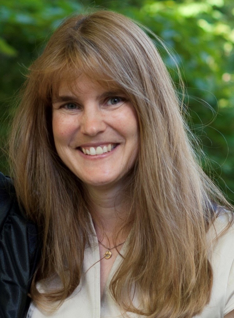 Jill Scalise's hair is auburn and worn down with bangs and she is smiling