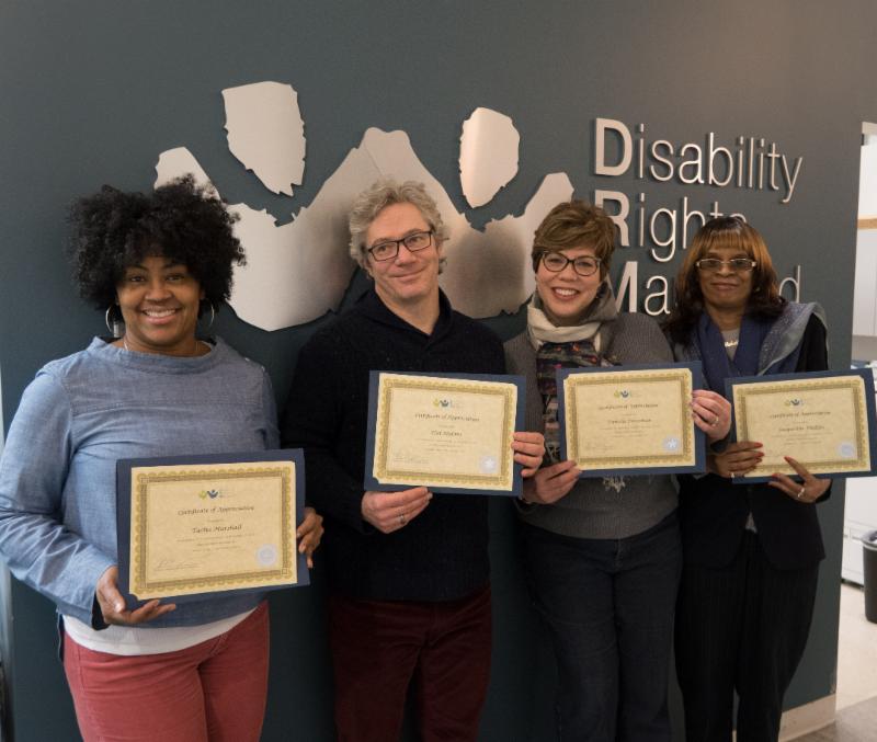 from left to right: Tacha Marshall displays her 30 year recognition certificate, Hal Malone displays his five-year certificate, Pamela Foresman showing her five-year certificate and Jacqueline Phillips shows her 20 year-certificate.