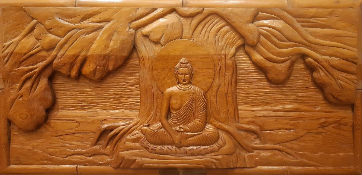 The prince finds enlightenment under the bodhi tree and becomes the Buddha (from painting by Nosu, Japan). Wood carving by Harry Koizumi. Photo by Paride Stortini, used with permission of the Buddhist Temple of Chicago The scene represents the moment when Siddhartha achieves enlightenment while meditating under the bodhi tree, becoming the Buddha, and calls the earth to witness his enlightenment by touching it.
