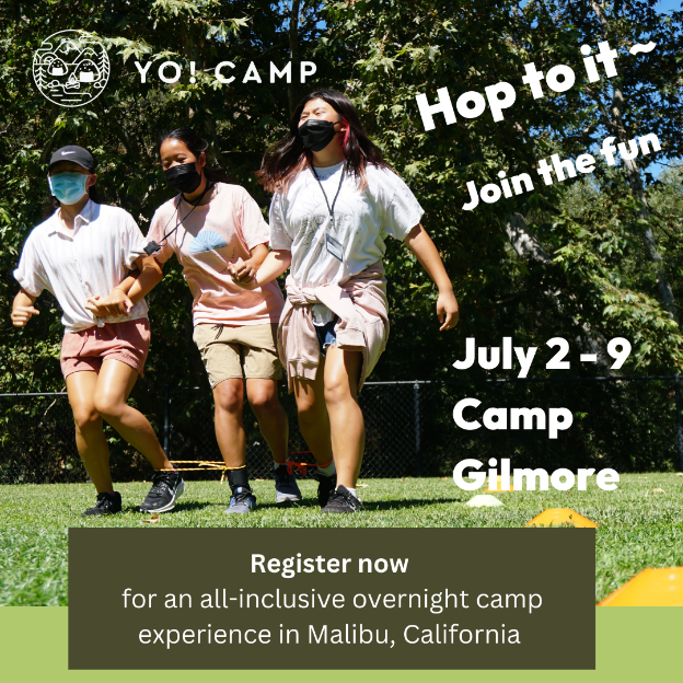 Group of three young girls running a three-legged race together.