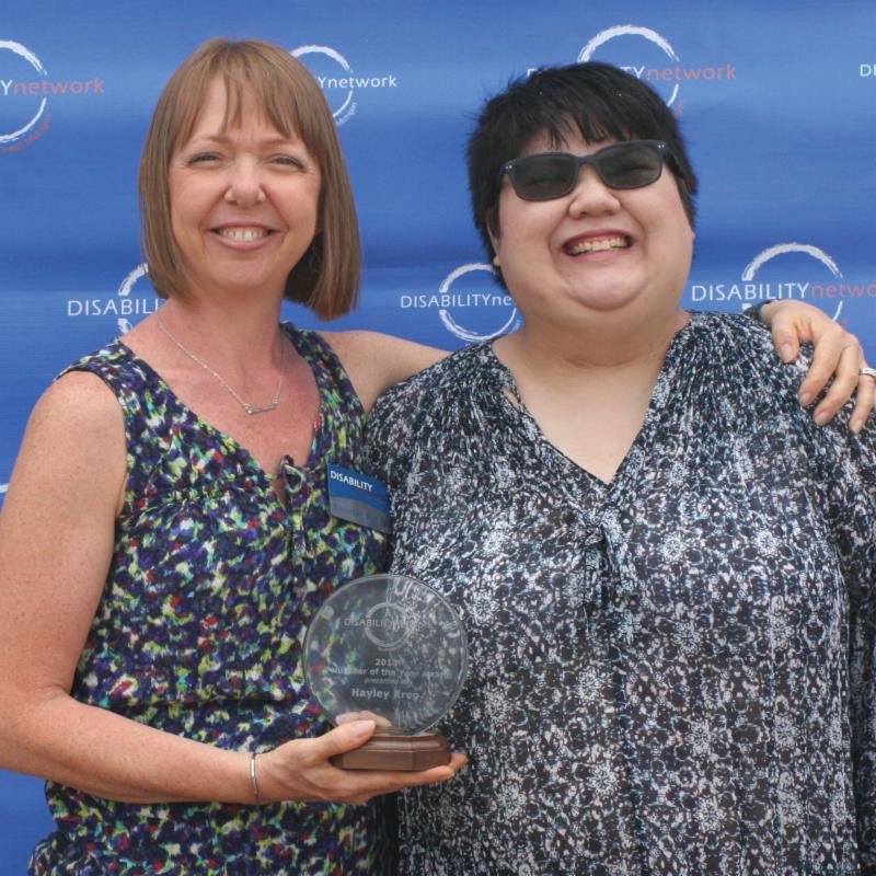 Hayley being presented with award