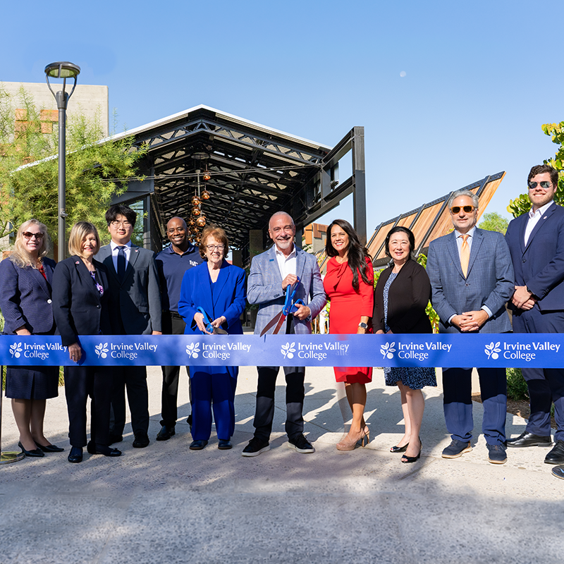 admin cutting a ribbon at the ribbon cutting ceremony