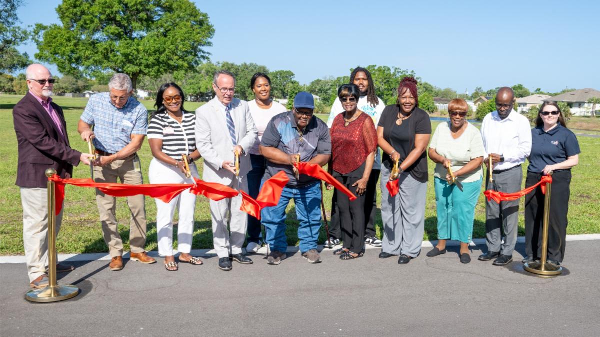 BCC Chair Dave Eggers joins County and community leaders to cut the ribbon on the new Dansville Park
