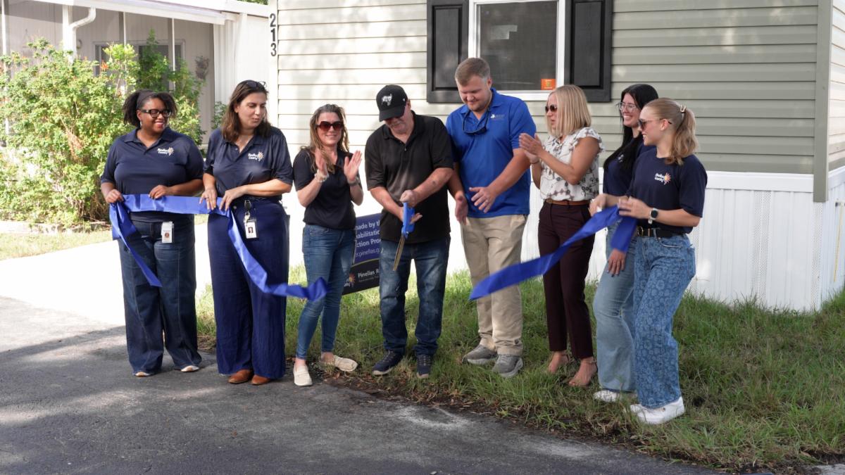Pinellas Recovers staff and a homeowner cut the ribbon on his new replacement home.