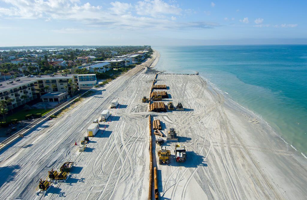 Crews working on the sand at Sand Key beach