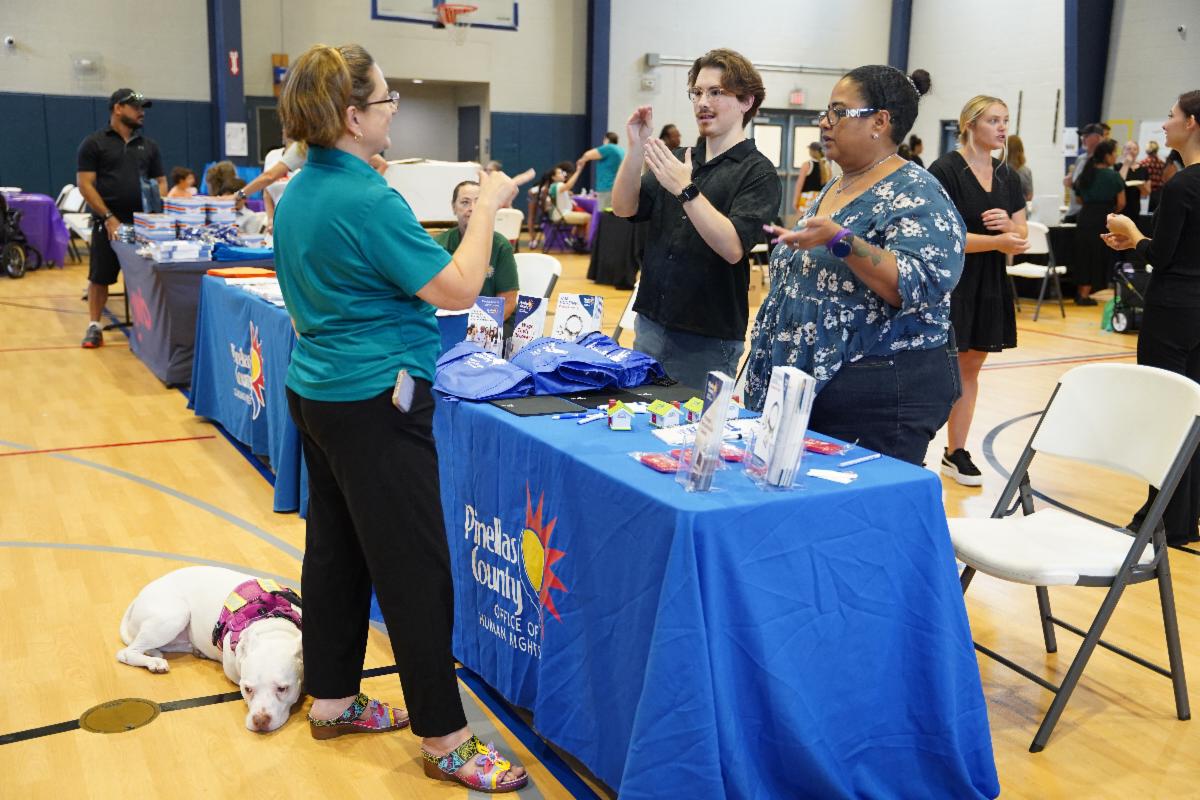 Pinellas County staff speak with attendees using American Sign Language at Deaf Fest 2025