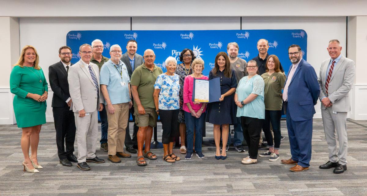 Board of County Commissioner pose with County staff to award proclamation to volunteers