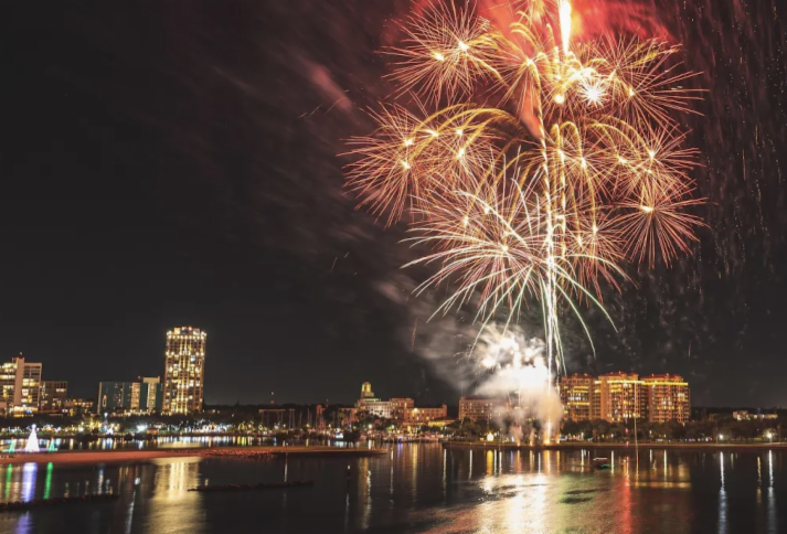 Fireworks going off above St. Pete city skyline