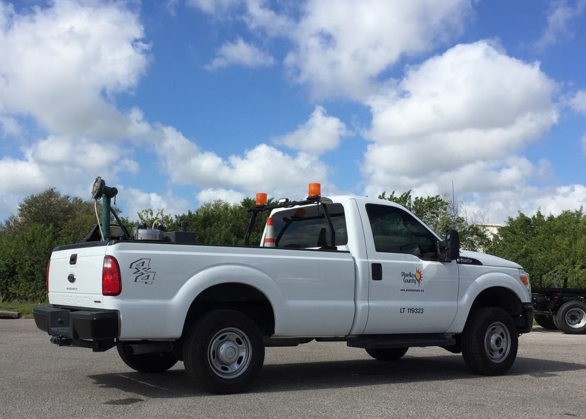 A Pinellas County mosquito control truck with treatment equipment in the bed.