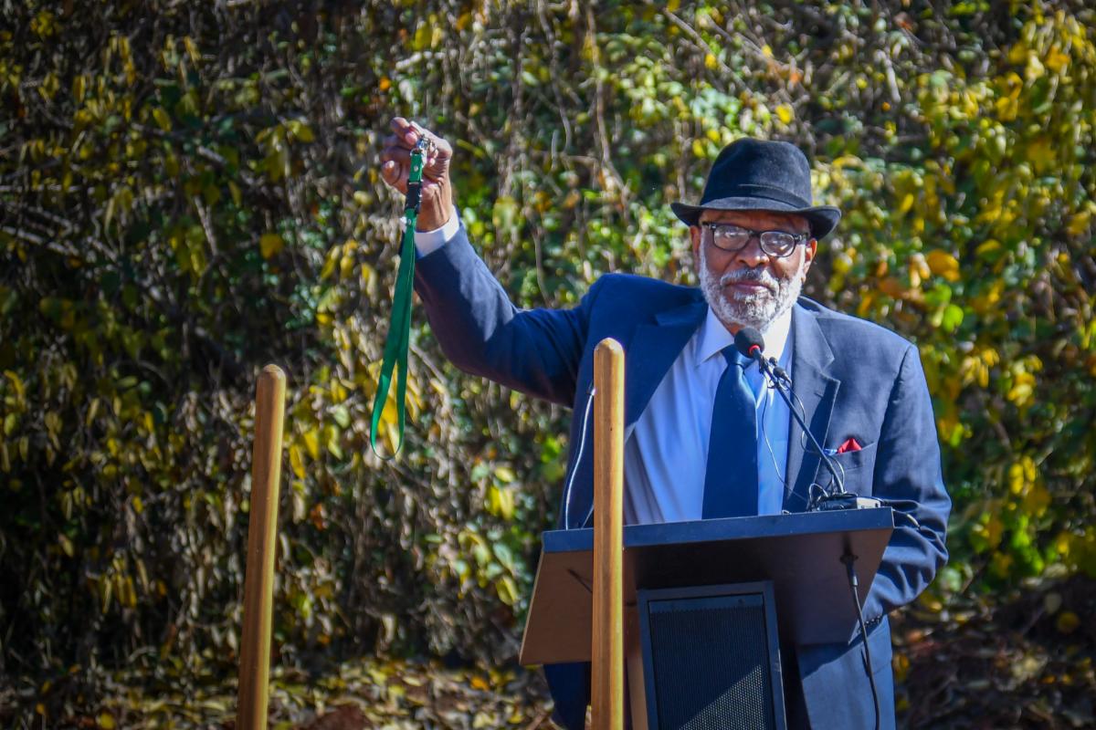 Gardner speaks at a lectern.
