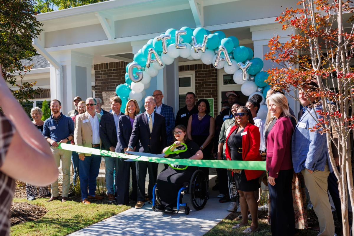 Ribbon cutting at an apartment.