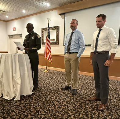 Two photos of Sonoma County Sheriff Eddie Engram honoring Sergeant Gary Lawson and Deputy Cody McCready for rescuing a woman from the Russian River