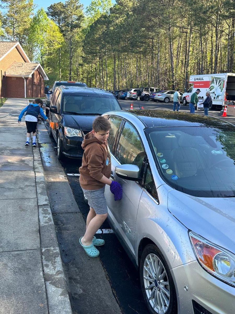 Youth washing cars