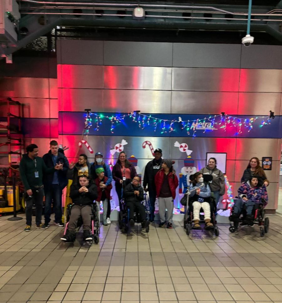 A group of Park School students sit and stand at Ogilvie Transportation Center.