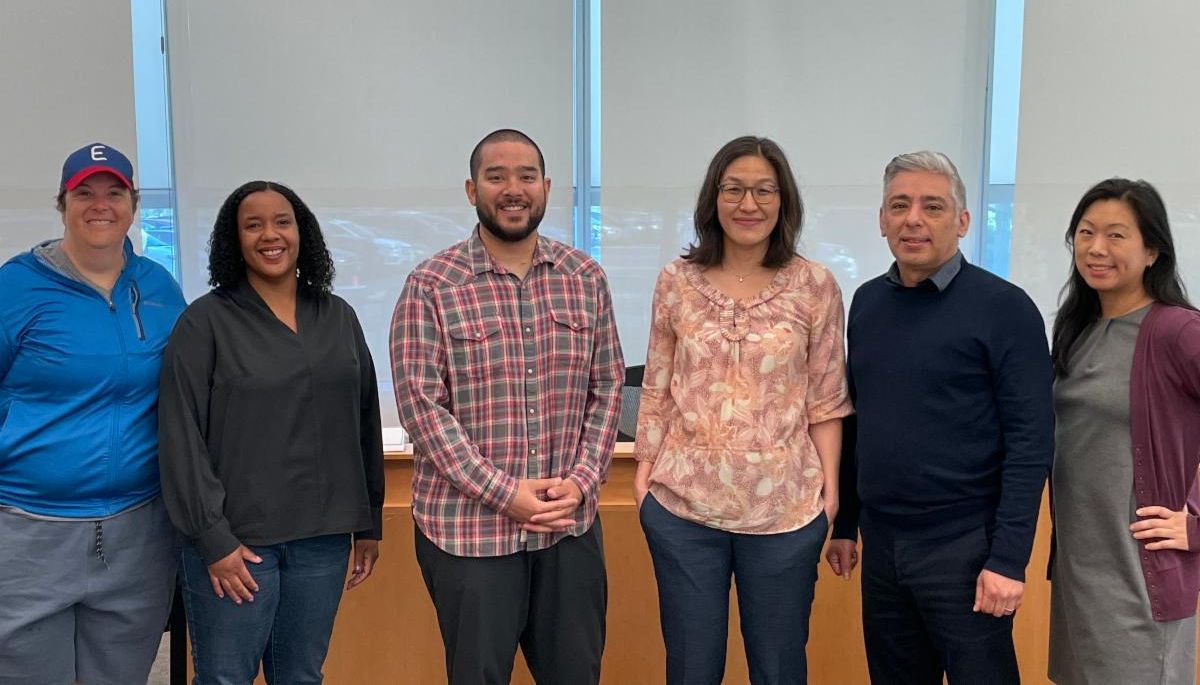 Six members of the Board of Education stand for a group photo at the May 10 special meeting.