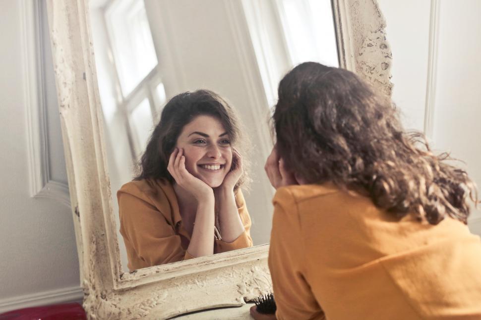 Woman looking in a mirrow