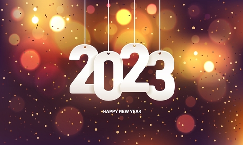 Happy new year 2023. Hanging white paper number with confetti on a colorful blurry background.