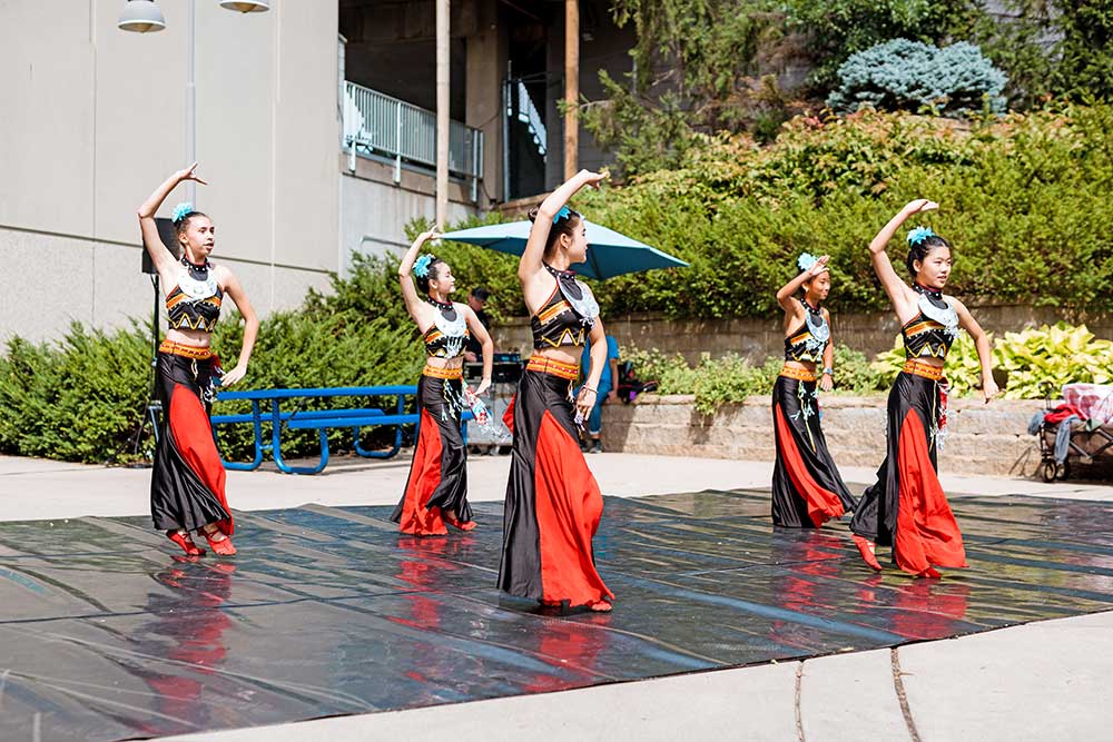 A dance group performing on the East Grandstand Plaza. 