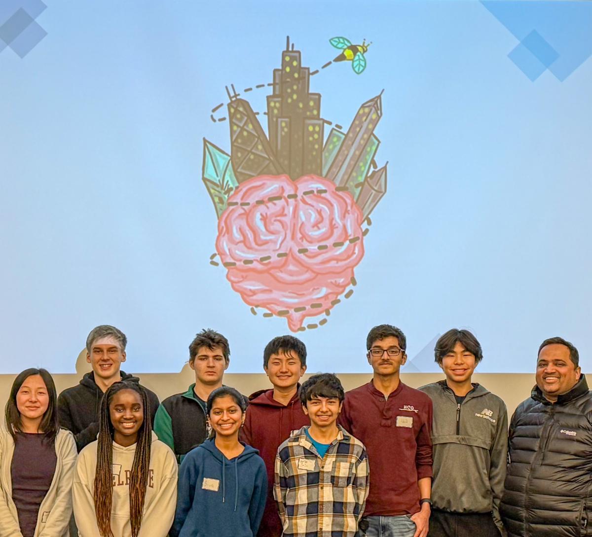 Several students pose in front of the Chicago Brain Bee mural