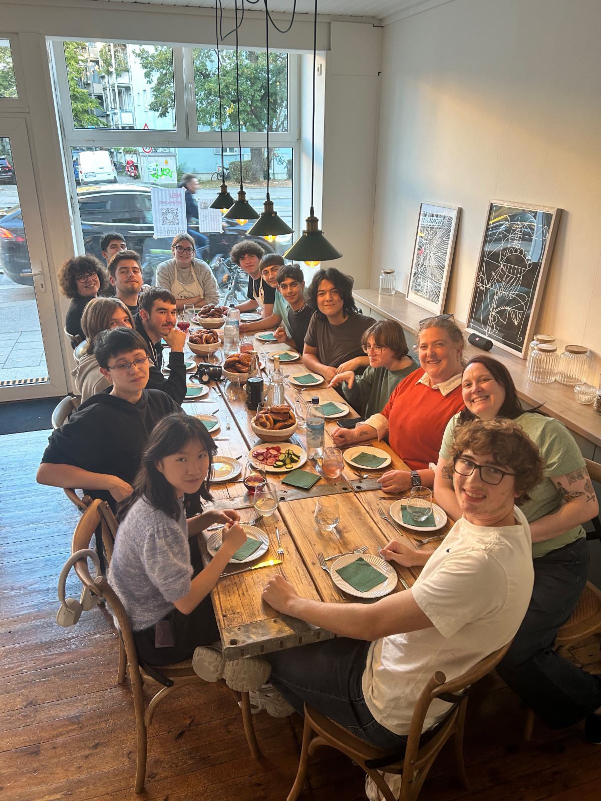 Students pose at a table at a German restaurant