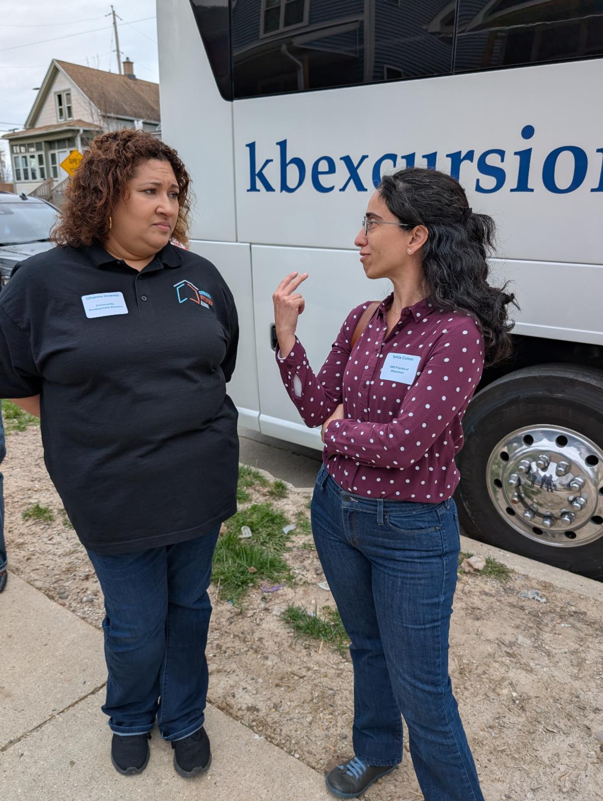 Johanna Jimenez of the Community Development Alliance (left) discusses housing policy with Tehila Cohen (right).
