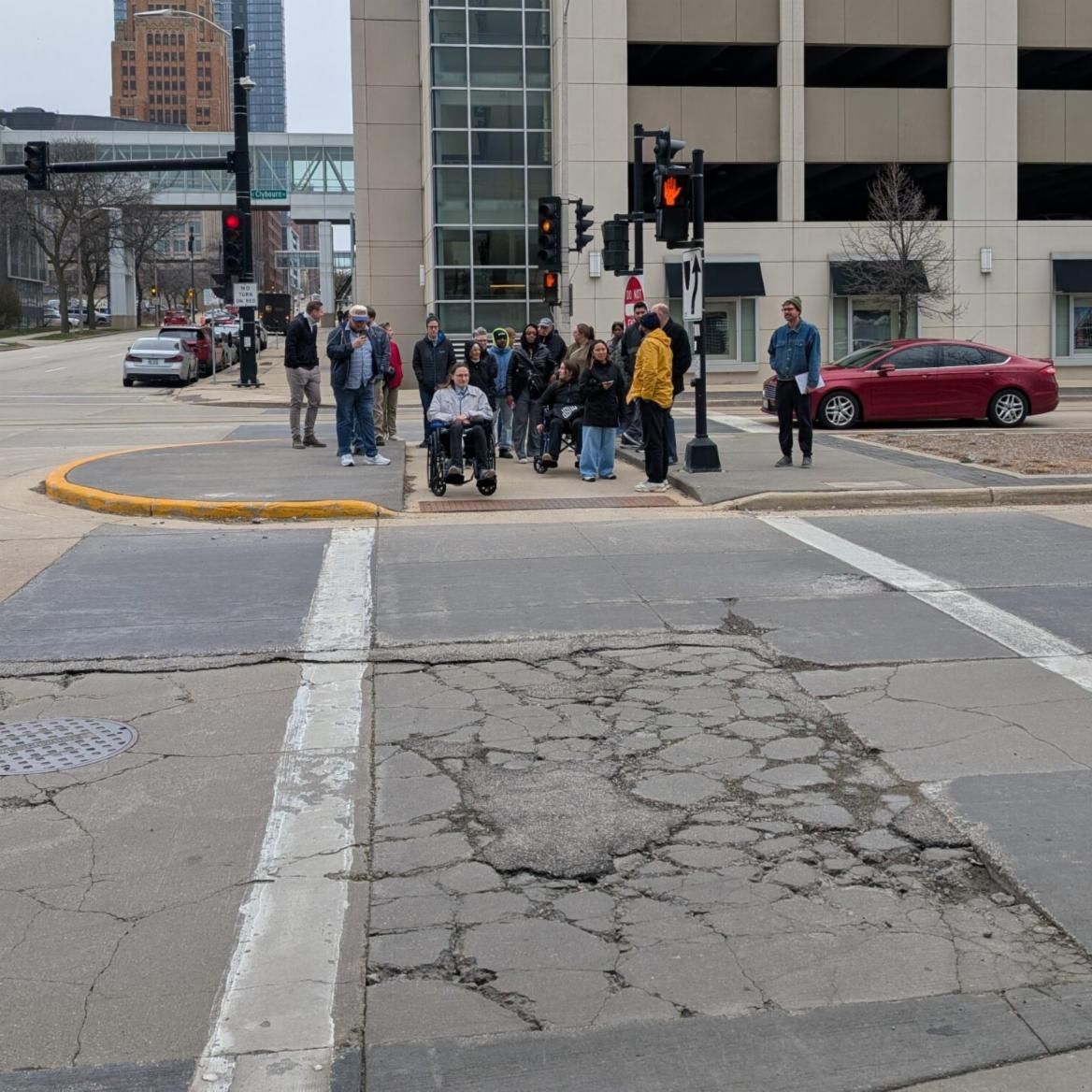 Given 10 seconds to cross, participants wait at the pedestrian island to make it across the crossing area