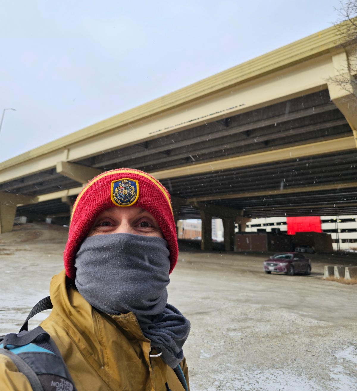 Trevor Roark, Executive Director of 1000 Friends of Wisconsin, poses in front of downtown Milwaukee freeway system