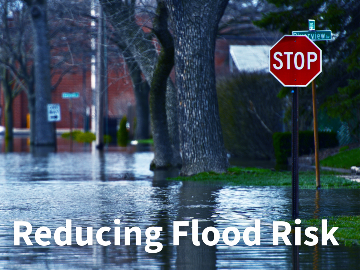 Reducing Flood Risk, flooded street with Stop Sign covered in water