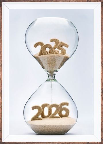 New Year 2026 concept with hourglass falling sand taking the shape of a 2026