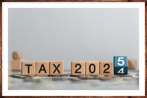 Tax 2025 concept with wooden blocks and letters. Business budget planning and investment growth in new year concept. Income tax filing and tax filing to pay tax documents online.
