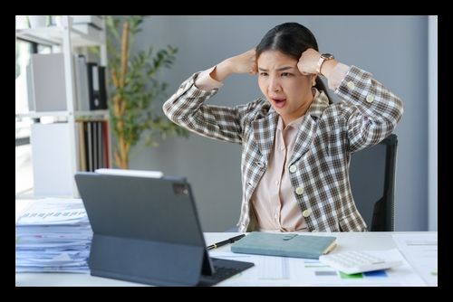 Asian businesswomen_ tired_ stressed office workers_ headaches over delayed work hours. Body aches_ discomfort_ work not being accomplished according to the set goals. Office syndrome concept.
