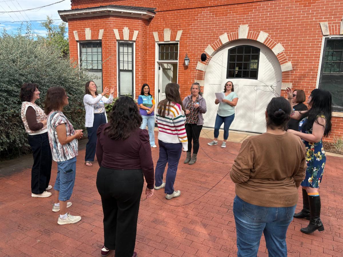 Event attendees participating in a systems navigation activity, illustrating how families might experience seeking and accessing health services.