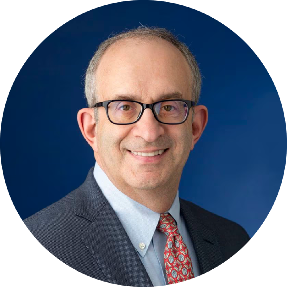 Alan Kadish M.D. wearing a suit and tie smiling