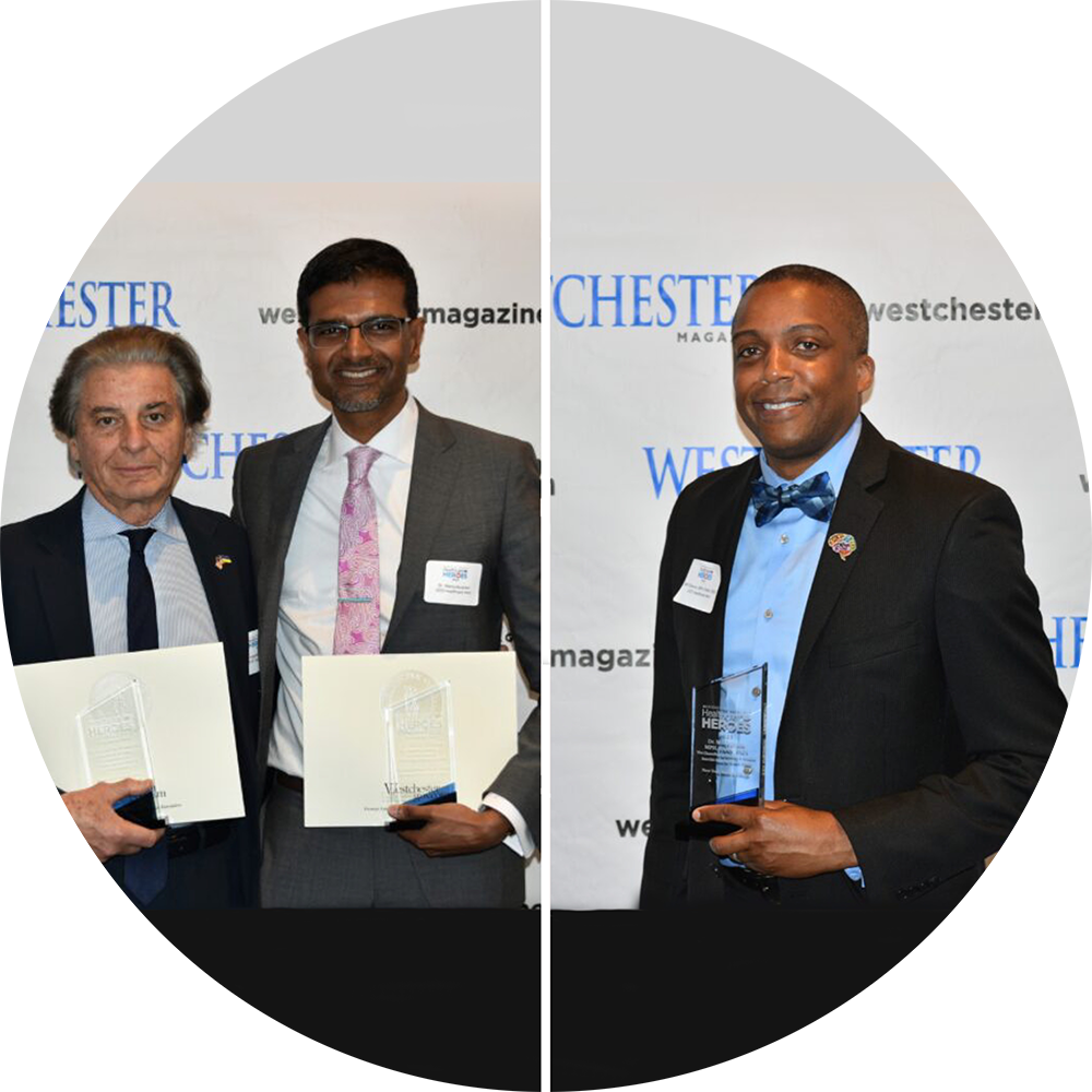 Dr Manoj Abraham Dr Augustine Moscatello and Dr Mill Etienne taking pictures with their awards