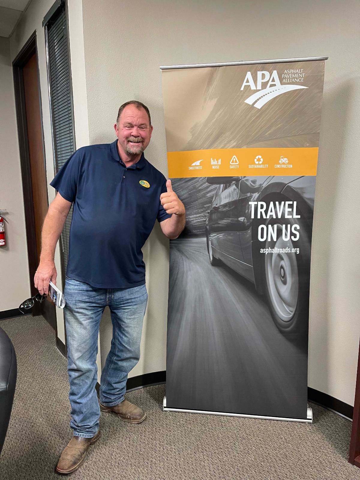 Pete Lambert and asphalt banner.
