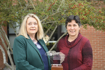 2025 SC Enironmental Awareness Award winner Melanie Ruhlman on right holding award with SCDES Director Myra Reece on right 