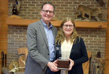 Photo of award winner Kelly Thorvalson and Kevin Mills president and CEO of the South Carolina Aquarium.