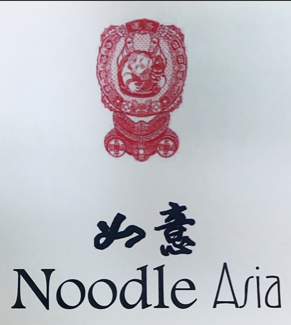 Noodle Asia at the celebrates 22 years in business with ribbon