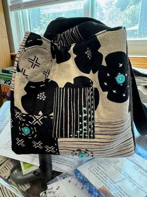 Black and white Rice Bag with appliqué flowers
