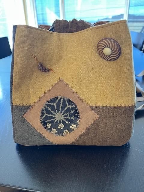 Neutral linen Rice Bag with appliqué accents