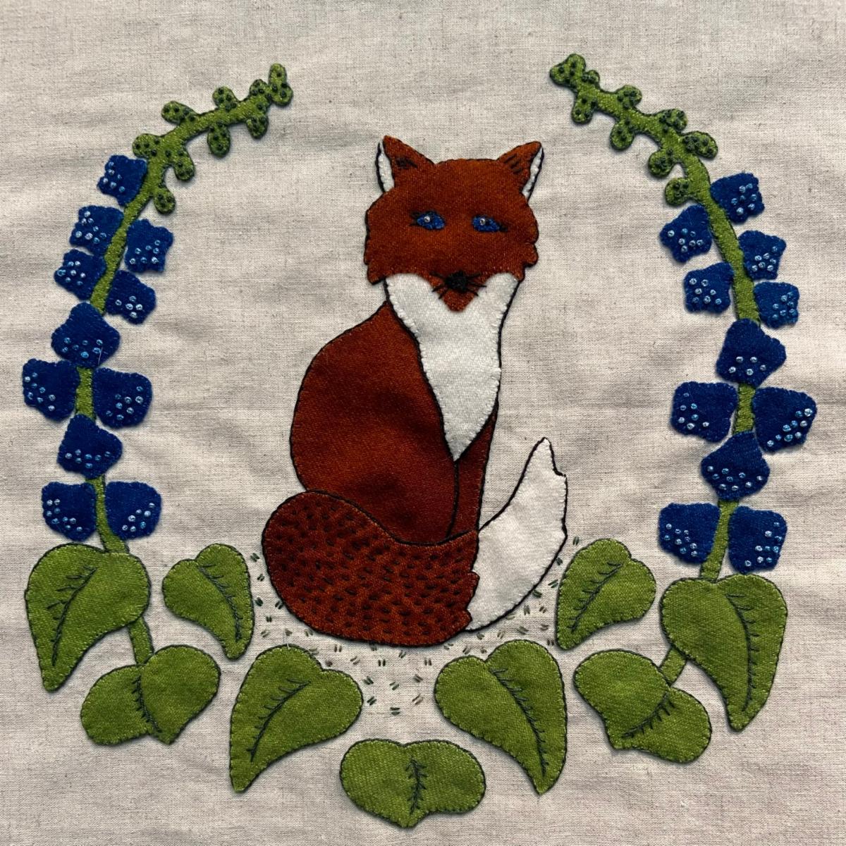 Walk in the Woods fox wool appliqué block with blue flowers