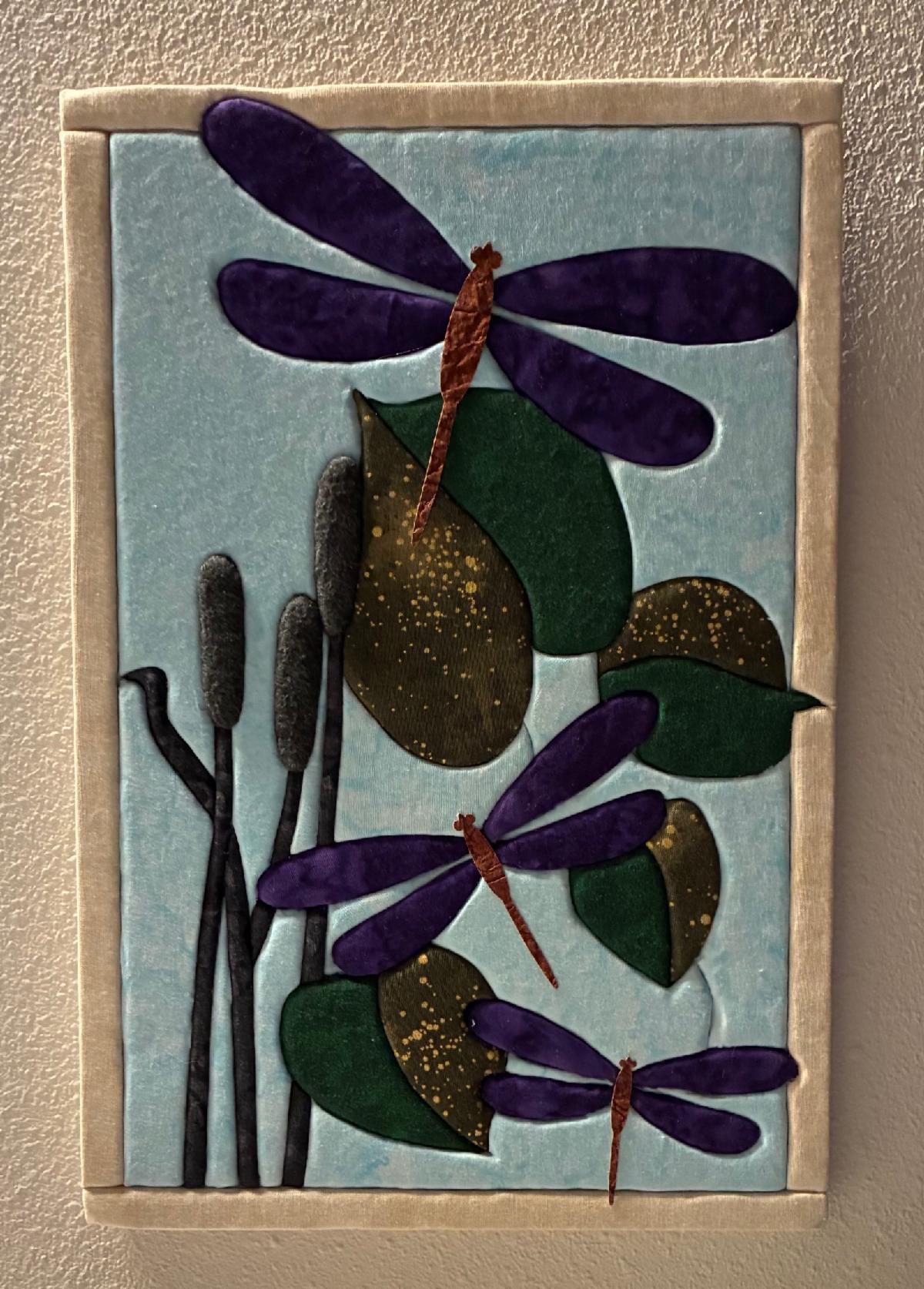 Susan's beautiful dragonfly quilt board in purple and green