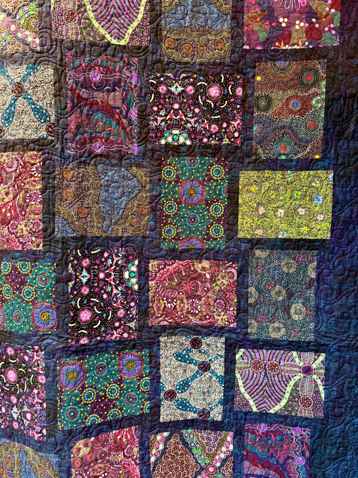 Australian Bounty colorful Aboriginal print quilt detail