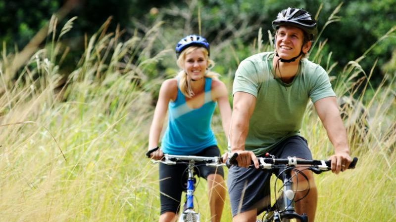 happy_couple_riding_bikes.jpg
