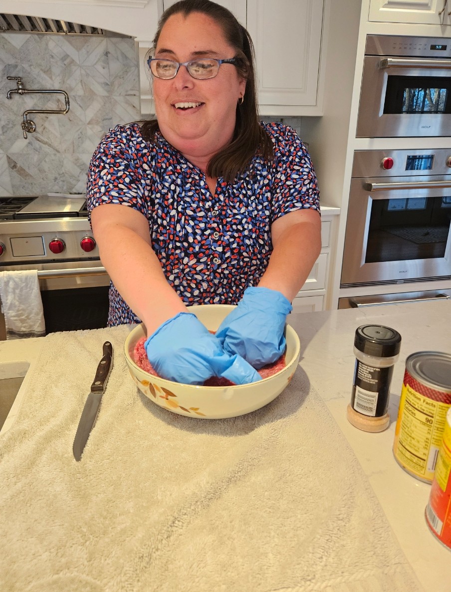 A person using a mixing bowl in the kitchen
