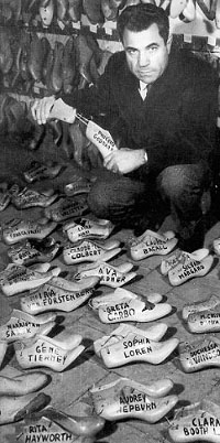Salvatore Ferragamo with shoe models of famous actresses